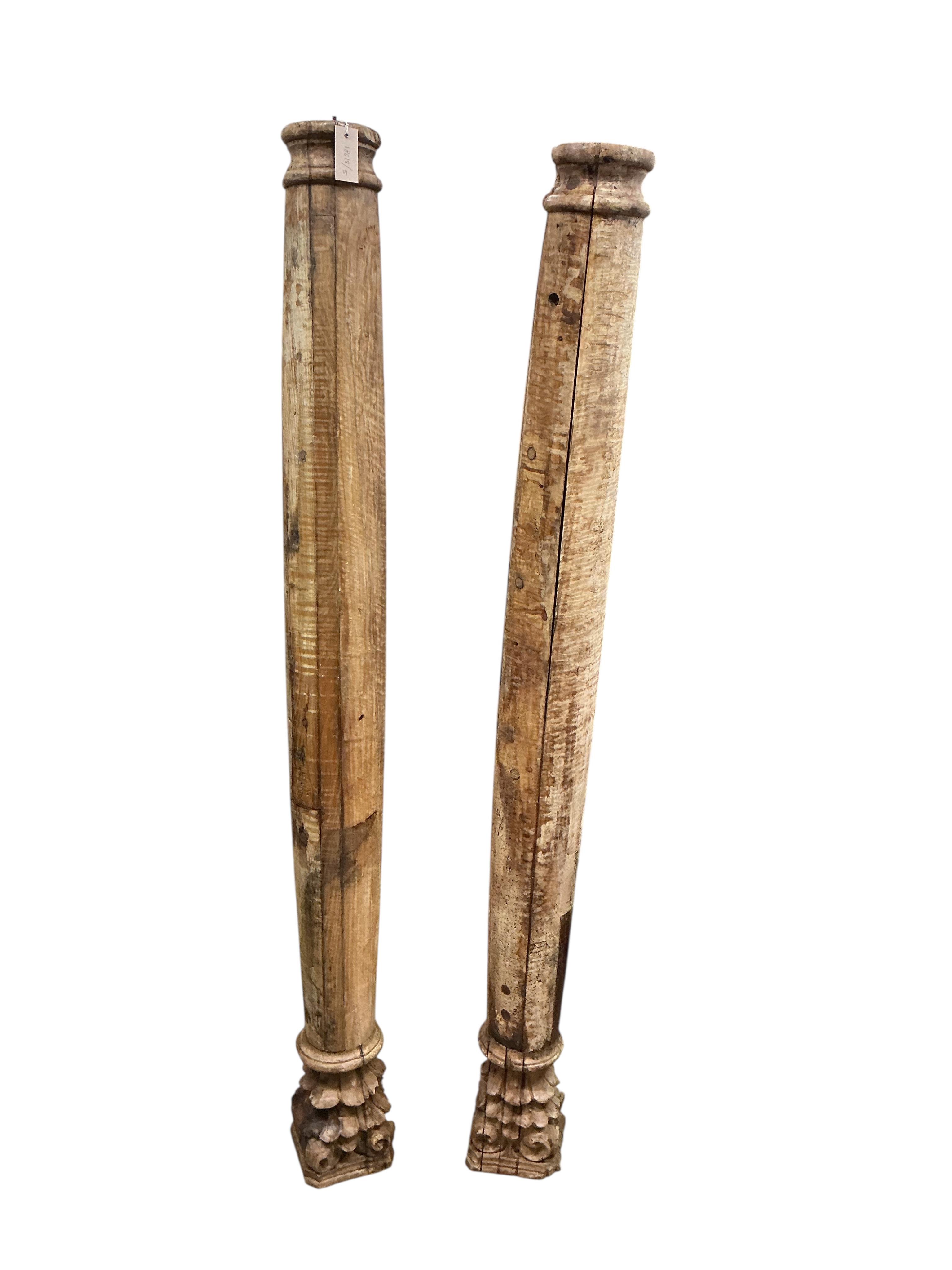 Two North Afrcian architectural carved wood columns, height 172cm